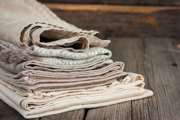 Linen tea towels beige on a wooden table