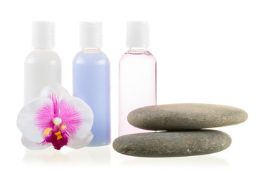 Fototapeta na wymiar set of cosmetics and stones for spa treatments isolated