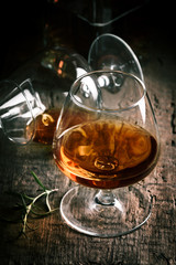 Glass of brandy or cognac and bottle