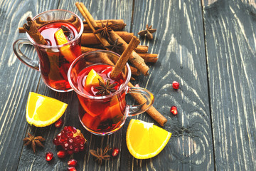 Hot mulled wine with apples, pomegranate, orange, anise and cinn