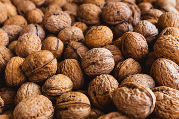 Whole walnuts background. Close up, top view.