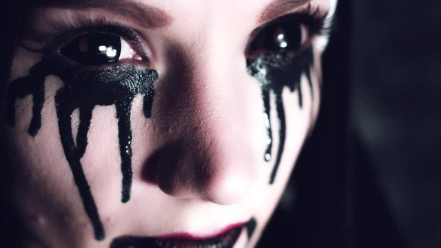 4k Halloween Shot of a Horror Woman With Black Liquid, close-up