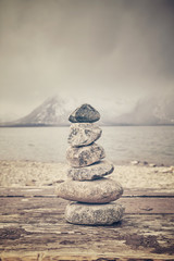 Vintage toned stack of stones, balance and harmony concept.