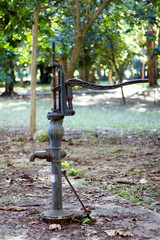 Hand pump leading to an artesian well