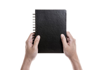 Two hands hold a empty(blank) ring binded book spread isolated white.