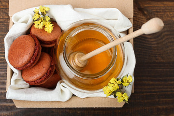 French delicious dessert macaroons with honey in the box