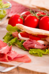 Piadina with ham and lettuce.