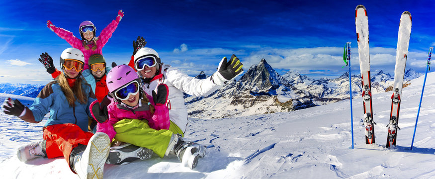 Skiing, winter, snow, sun and fun - family enjoying winter vacation.