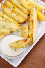 Baked parmesan potato wedges. View from above, top studio shot