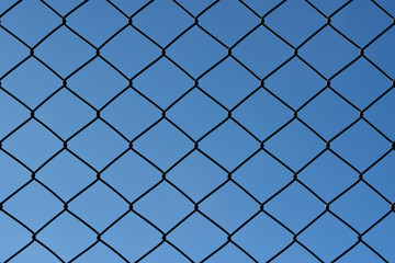 Fototapeta premium wire mesh steel with sky background