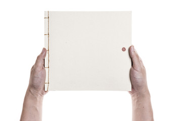 Fototapeta premium A man(male) hold a empty(blank, vacant) vintage book isolated white.