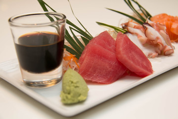  platter of sashimi sushi with tuna and salmon