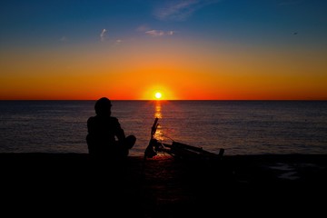 Barcelona, Spain. November 23, 2016: Silhouette of lonely cyclist staying on the background of...