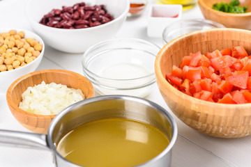 Fresh Food Ingredients On White Wood Kitchen Table