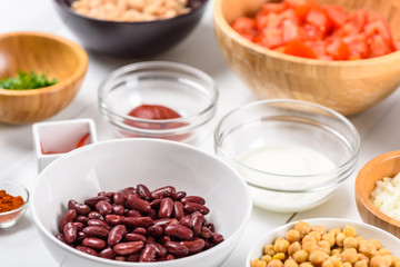 Fresh Food Ingredients On White Wood Kitchen Table