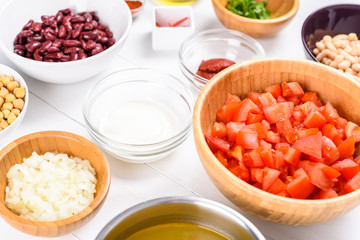 Fresh Food Ingredients On White Wood Kitchen Table