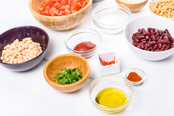 Fresh Food Ingredients On White Wood Kitchen Table