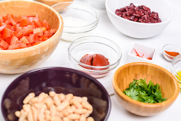 Fresh Food Ingredients On White Wood Kitchen Table