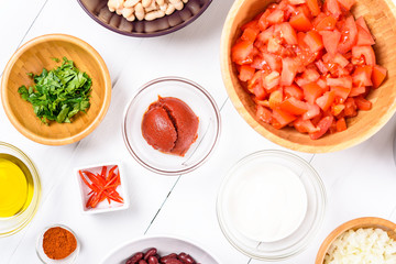 Fresh Food Ingredients On White Wood Kitchen Table