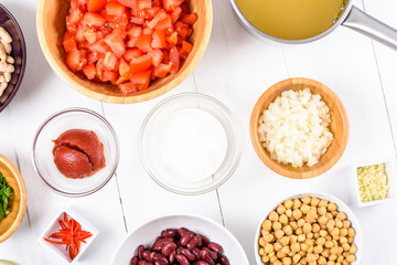 Fresh Food Ingredients On White Wood Kitchen Table
