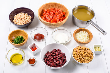 Fresh Food Ingredients On White Wood Kitchen Table