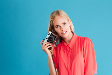 Young pretty girl taking photo using camera