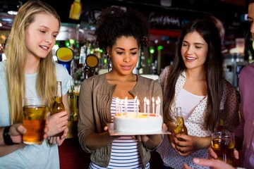 Friends celebrating with cake