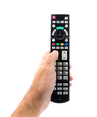 Hand holding TV remote control, isolated on white background