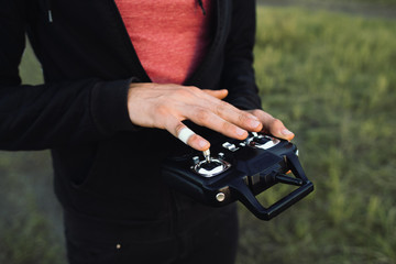 Man touching remote controller close-up, free space. Unrecognizable blind studying transmitter before piloting vehicle. Touch, modern technologies, life, leisure concept