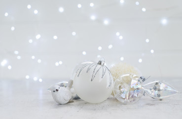 White winter christmas scene with balls and bird decorations