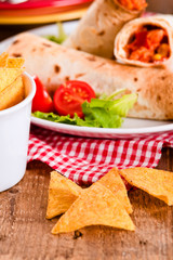 Tortilla wraps with chicken and vegetable. 