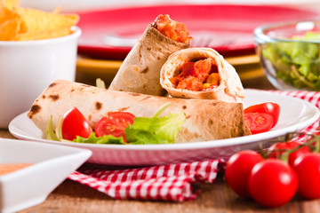 Tortilla wraps with chicken and vegetable. 