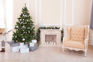 New Year's scenery in the light room. Christmas fir-tree. Classical interior