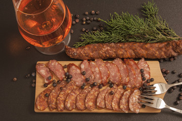 Tasty sausage, red beer and green juniper