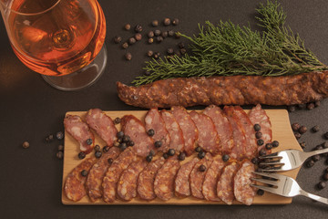 Tasty sausage, red beer and green juniper