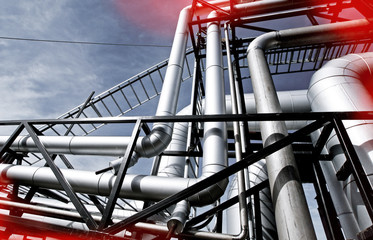Industrial zone, Steel pipelines and valves against blue sky