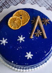 Naklejka premium mirror glaze mousse cake with winter decoration