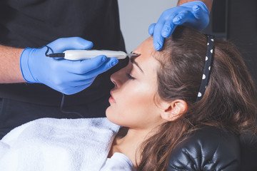 woman treatment with ultrasonic spatula