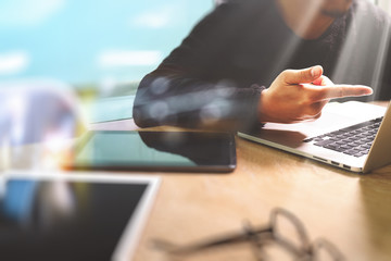 Designer hand working with digital tablet computer and smart pho