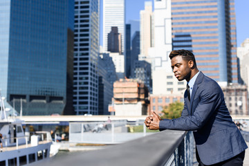 Young african businessman working on the laptop outdoor