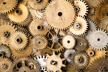 Vintage gears macro view. Aged mechanical clock wheels background. Shallow depth of field