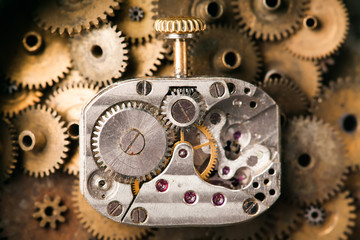 Antique mechanical hand watch macro view. rusty grunge textured metal gears background. Shallow depth of field