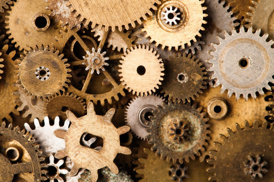 Steampunk gears background. Aged mechanical clock wheels close-up. Shallow depth of field