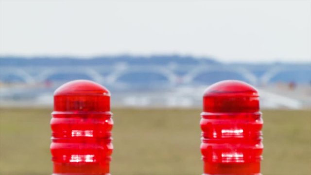 Airport Runway Lights Focus Pull to Landing Regional Jet Airliner on Runway at Ronald Reagan National Airport DCA in Washington DC