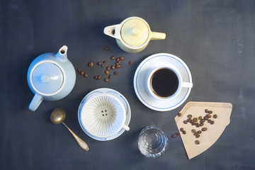 Obraz na płótnie Canvas cup of coffee,coffee pots,coffee filter, vintage objects, flat lay