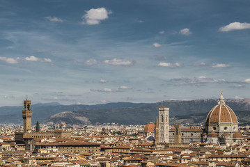 Fototapeta na wymiar Florence, Italy- August 12, 2016: Cityscape of the city of Florence with the Tower of Palazzo Vecchio and Church Santa Maria del Fiore in Florence, Italy