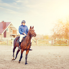 Sportsman riding horse on equestrian competition.