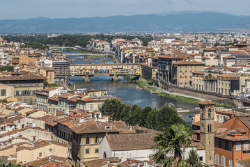 Fototapeta na wymiar Florence, Italy- August 12, 2016: Cityscape of the city of Florence with the Ponte Vecchio overlooking the Arno River in Florence, Italy