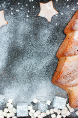 Carrot cake in the shape of a Christmas tree in the Christmas decor, top view, selective focus
