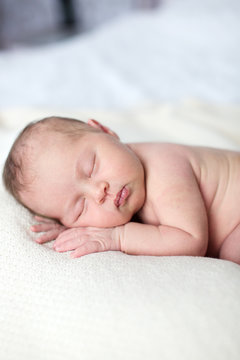 newborn sleeping on light background, real life,  lifestyle,